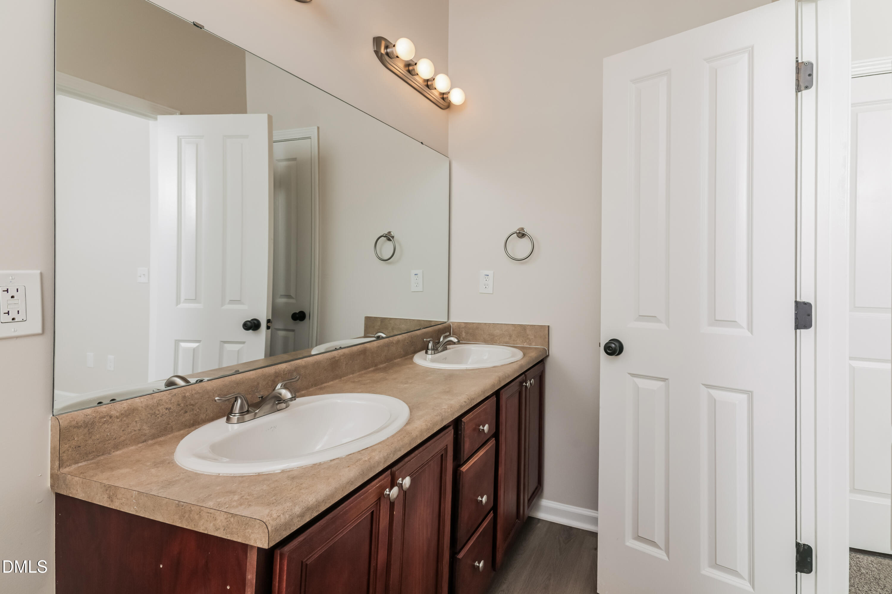 58 Magnolia Vine Lane Smithfield, NC 27577 - Photo 12 of 17 a bathroom with a granite countertop sink and a mirror
