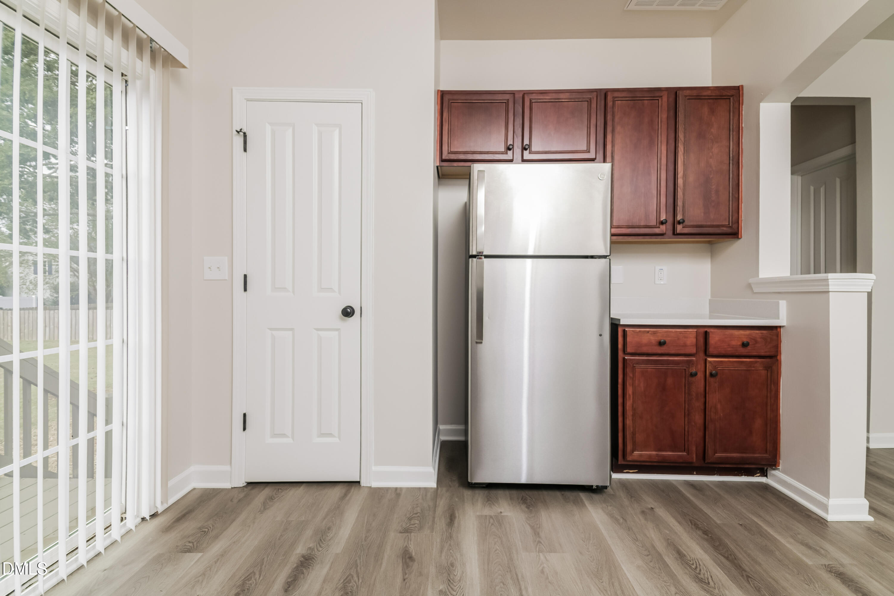 58 Magnolia Vine Lane Smithfield, NC 27577 - Photo 6 of 17 a view of kitchen with wooden floor electronic appliances and windows