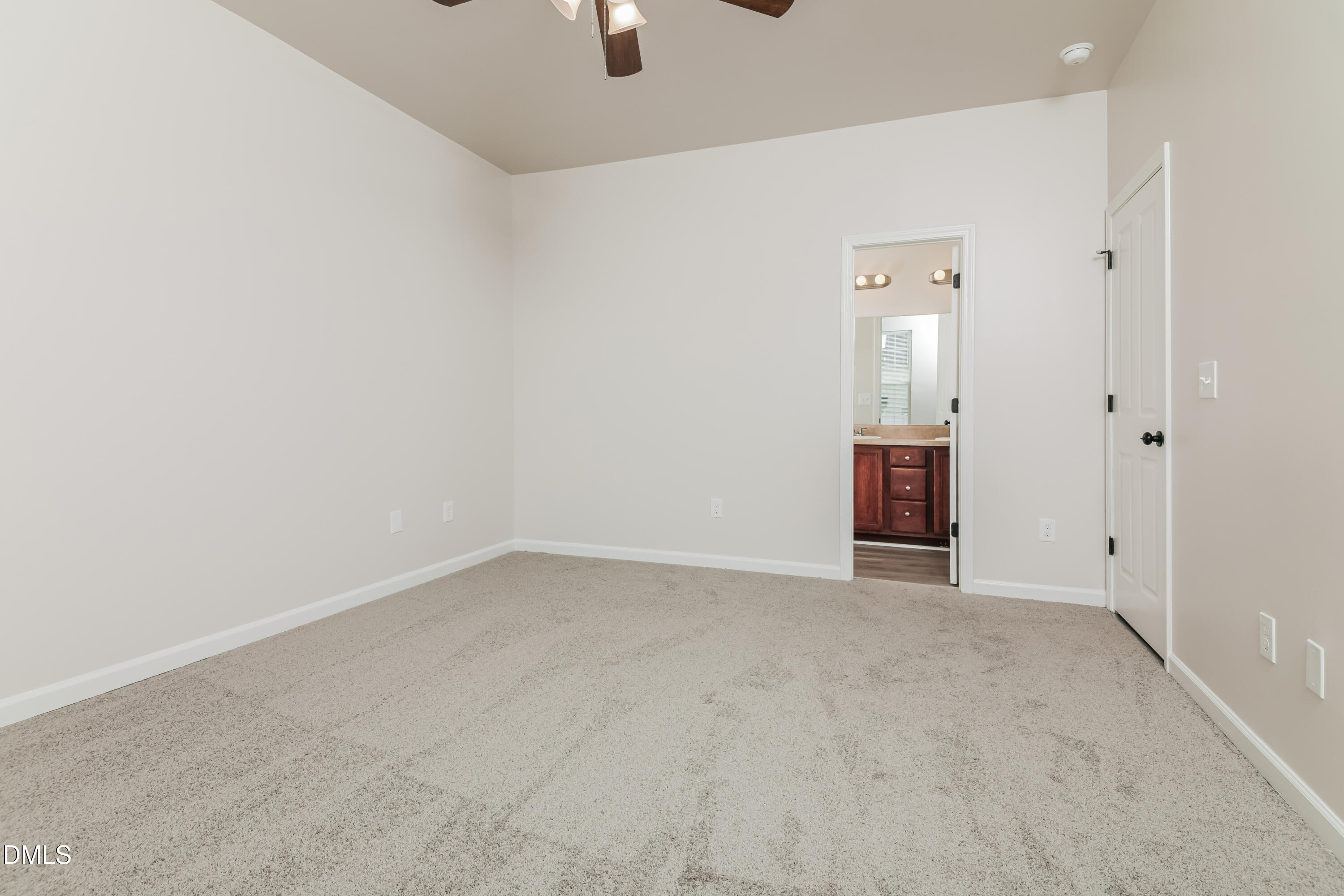 58 Magnolia Vine Lane Smithfield, NC 27577 - Photo 7 of 17 an empty room with fan and mirror