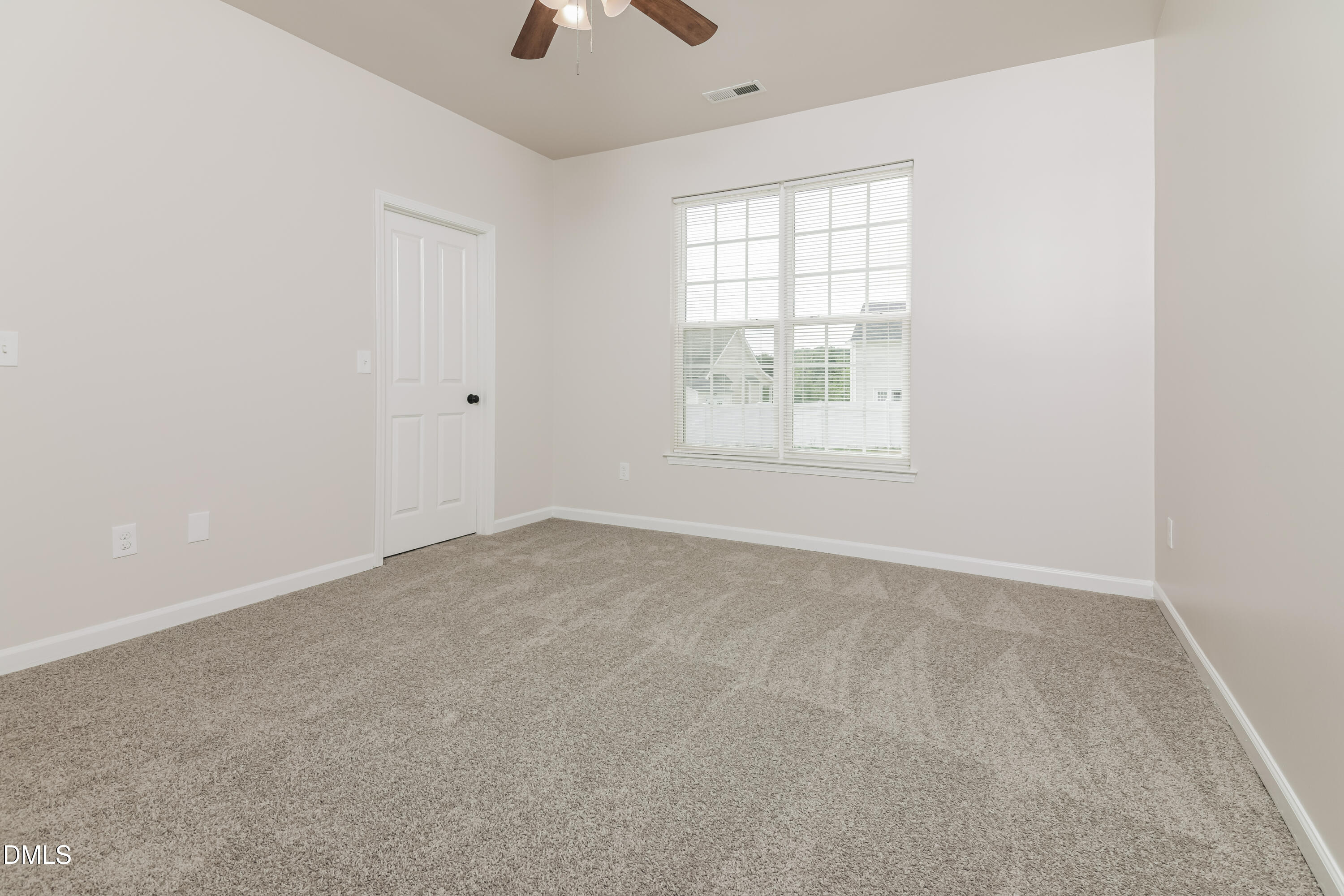 58 Magnolia Vine Lane Smithfield, NC 27577 - Photo 8 of 17 an empty room with windows