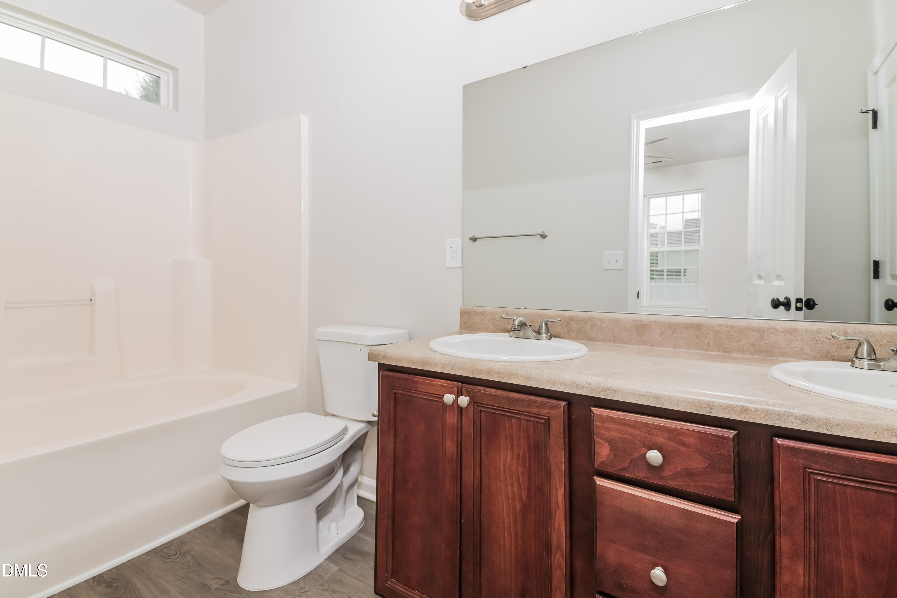 58 Magnolia Vine Lane Smithfield, NC 27577 - Photo 9 of 17 a bathroom with a granite countertop sink toilet and shower
