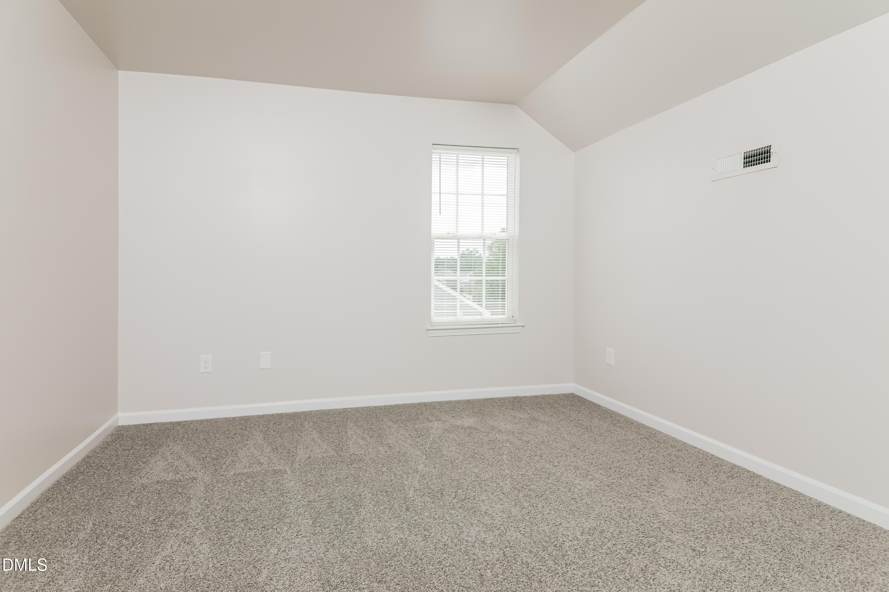 58 Magnolia Vine Lane Smithfield, NC 27577 - Photo 10 of 17 an empty room with a window