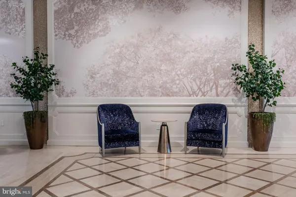 a view of two chairs and a table