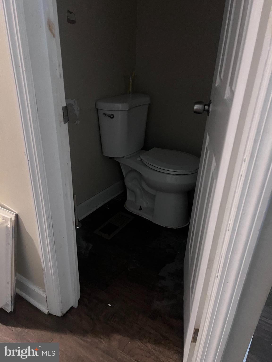 401 South Vincent Street Baltimore, MD 21223 - Photo 6 of 10 a bathroom with a toilet and a shower