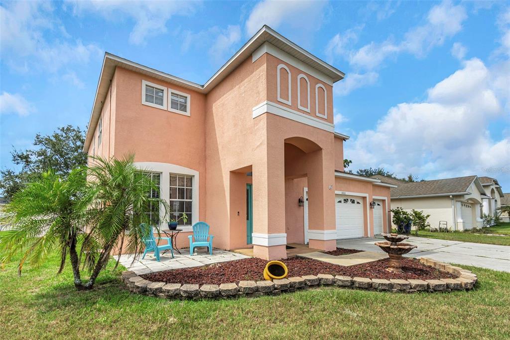 a front view of a house with a yard