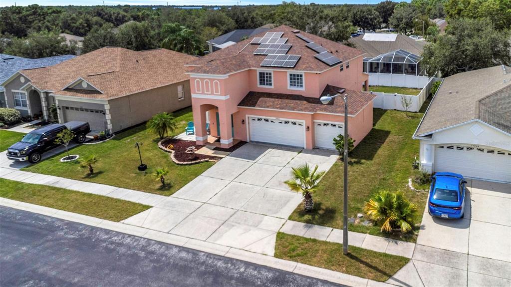 an aerial view of a house with swimming pool