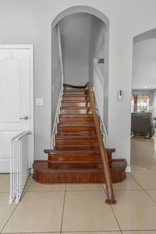 a spacious bathroom with a tub sink shower and mirror