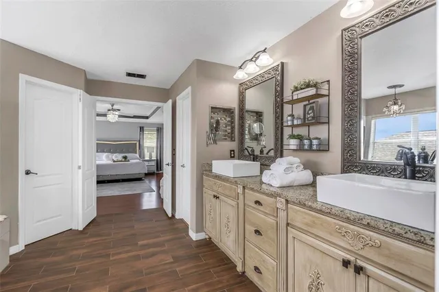 a bedroom with a bed and lamps