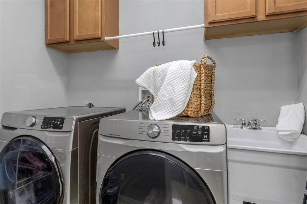 14818 Edgemere Drive Spring Hill, FL 34609 - Photo 38 of 72 a utility room with dryer and washer