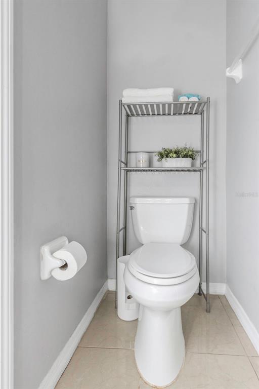 14818 Edgemere Drive Spring Hill, FL 34609 - Photo 40 of 72 a white toilet sitting next to a bathroom sink