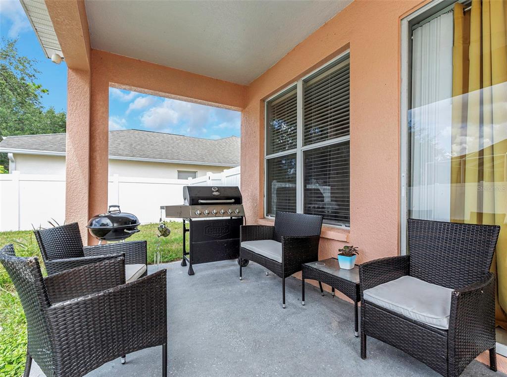 14818 Edgemere Drive Spring Hill, FL 34609 - Photo 42 of 72 a outdoor living space with furniture and a window