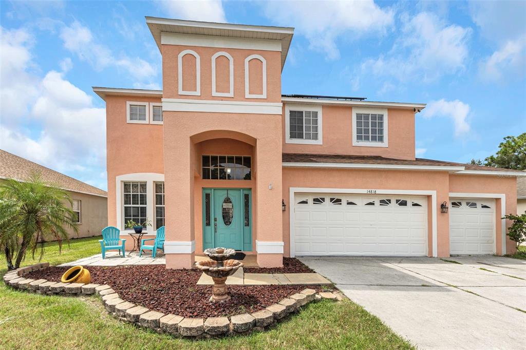 14818 Edgemere Drive Spring Hill, FL 34609 - Photo 5 of 72 a front view of a house with garden