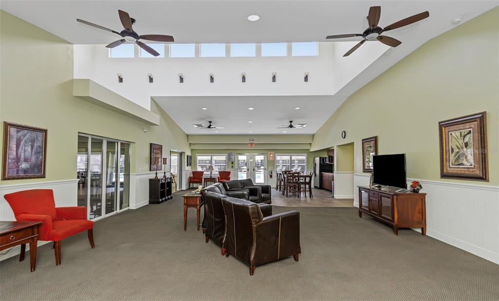 14818 Edgemere Drive Spring Hill, FL 34609 - Photo 57 of 72 a living room with furniture and a flat screen tv