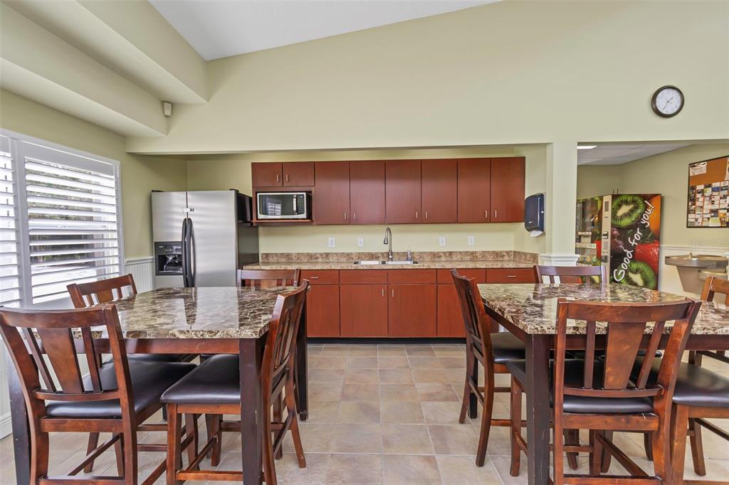 14818 Edgemere Drive Spring Hill, FL 34609 - Photo 58 of 72 a view of a dining room with furniture and window