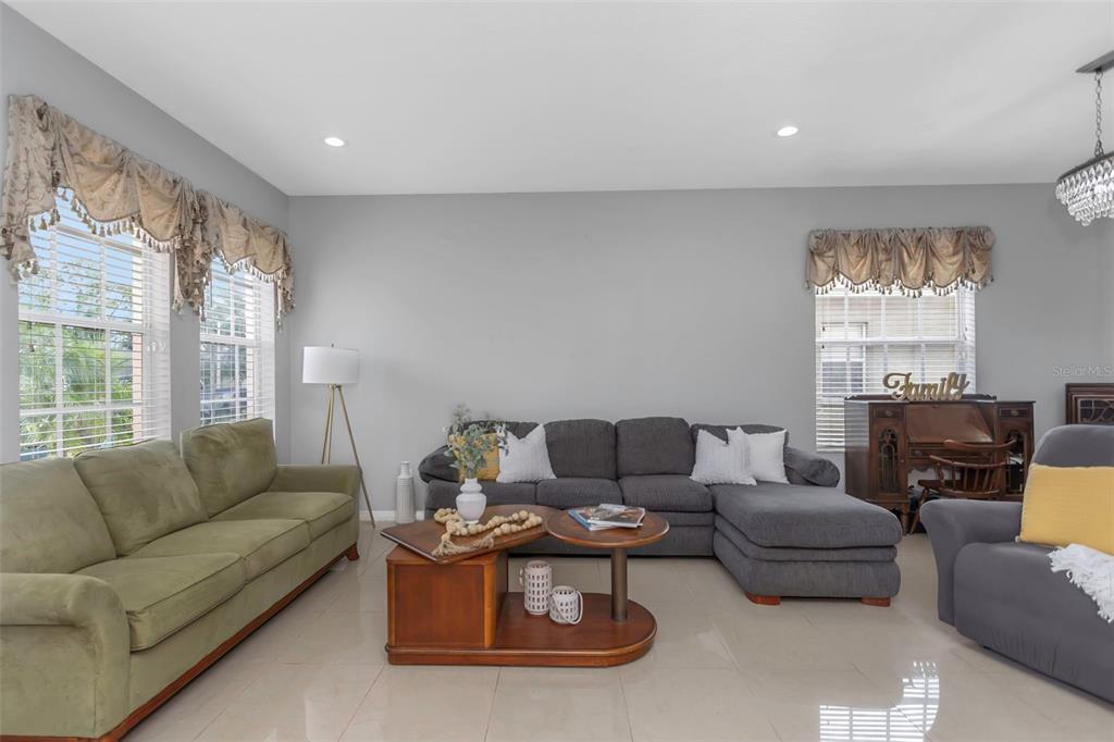 14818 Edgemere Drive Spring Hill, FL 34609 - Photo 9 of 72 a living room with furniture and a large window
