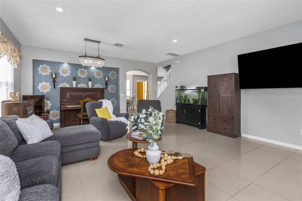 14818 Edgemere Drive Spring Hill, FL 34609 - Photo 10 of 72 a living room with furniture and a flat screen tv