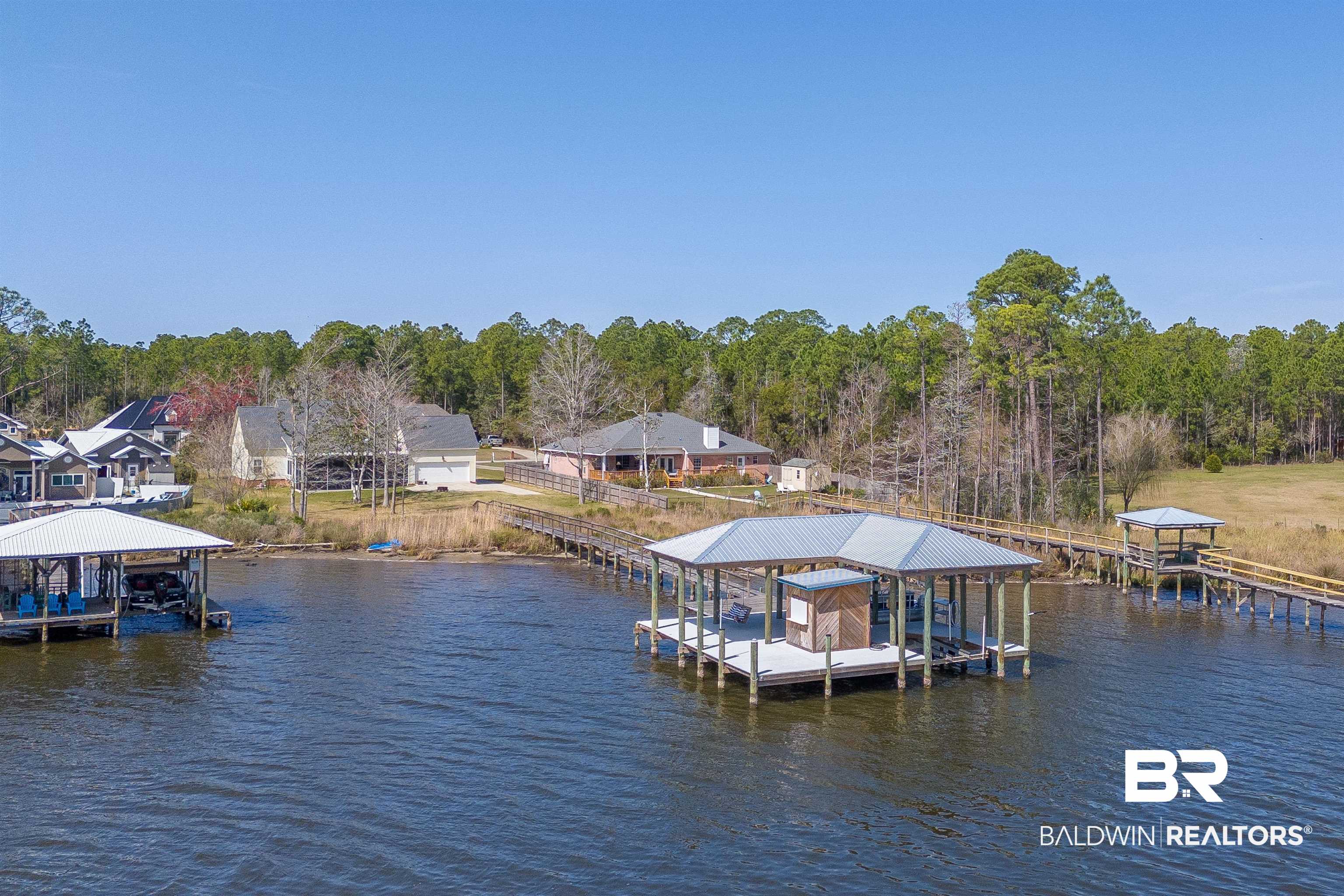 8915 Bay Point Drive Elberta, AL 36530 - Photo 27 of 74 View of dock featuring a water view and boat lift