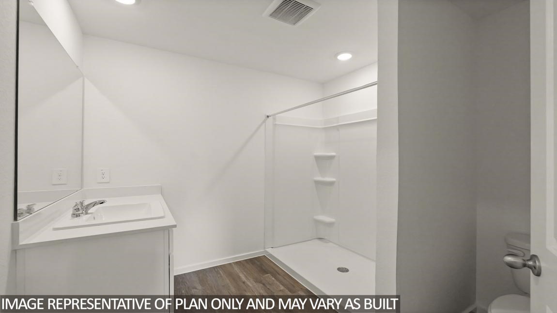 23712 Patchouli Terrace Drive Splendora, TX 77372 - Photo 13 of 32 a bathroom with a sink a toilet and shower