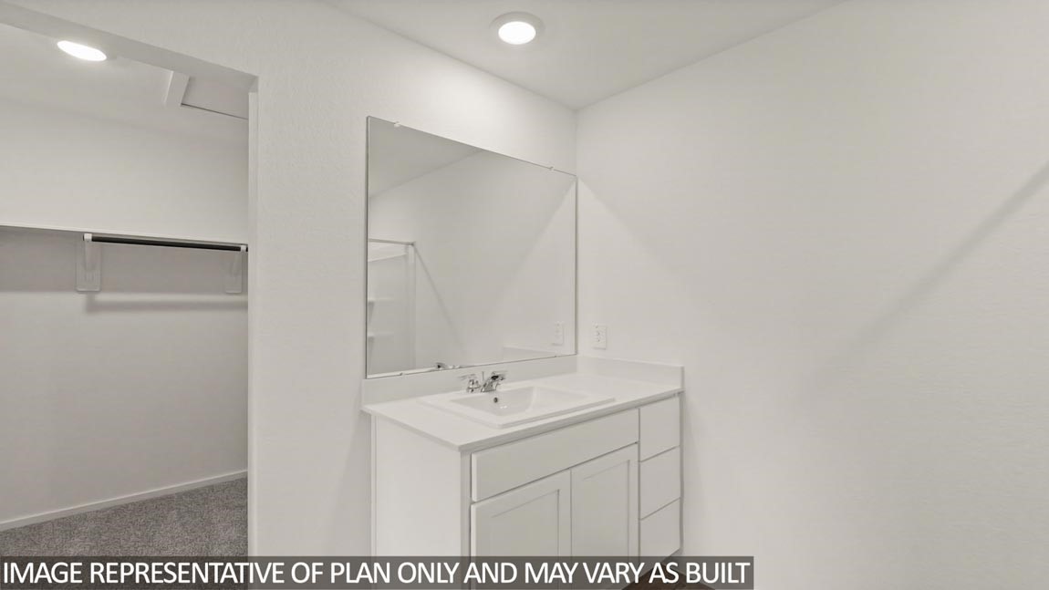 23712 Patchouli Terrace Drive Splendora, TX 77372 - Photo 14 of 32 a bathroom with a sink and a mirror