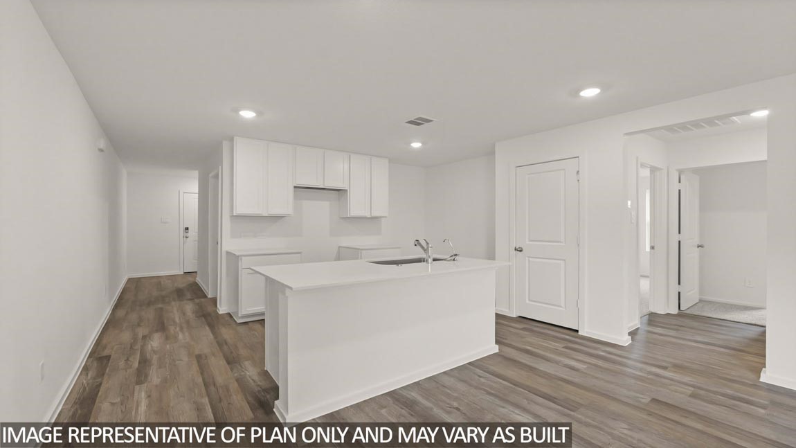 23712 Patchouli Terrace Drive Splendora, TX 77372 - Photo 4 of 32 a large white kitchen with wooden floor
