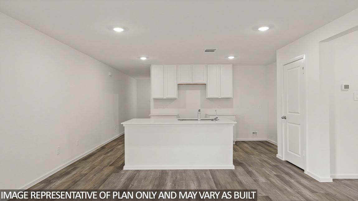 23712 Patchouli Terrace Drive Splendora, TX 77372 - Photo 5 of 32 a view of a kitchen with white cabinets