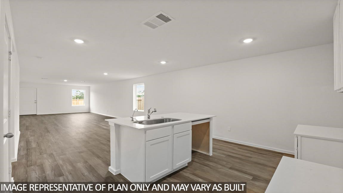 23712 Patchouli Terrace Drive Splendora, TX 77372 - Photo 6 of 32 a view of kitchen and empty room with wooden floor