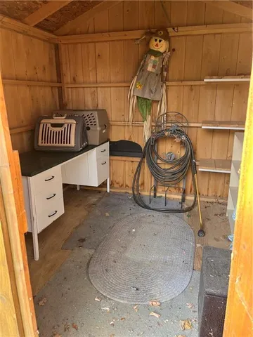 a utility room with a sink and cabinets