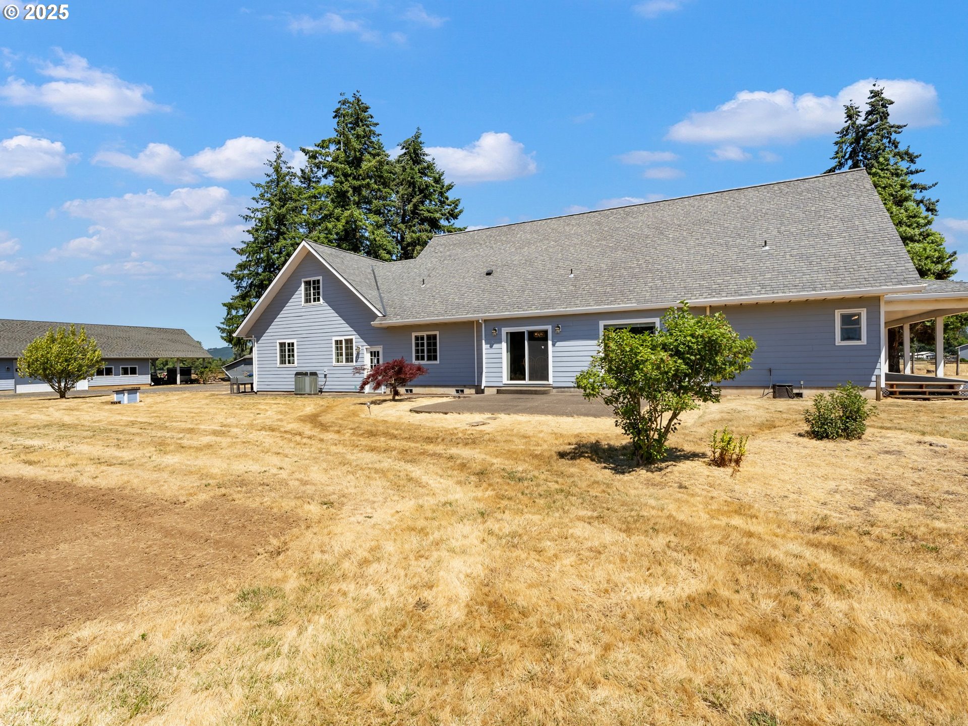 24700 Southwest Rogers Road Sheridan, OR 97378 - Photo 34 of 48 a front view of a house with a yard