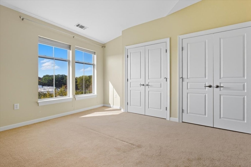 4 Repton Place, Unit 4410 Watertown, MA 02472 - Photo 15 of 41 a view of an empty room with a window