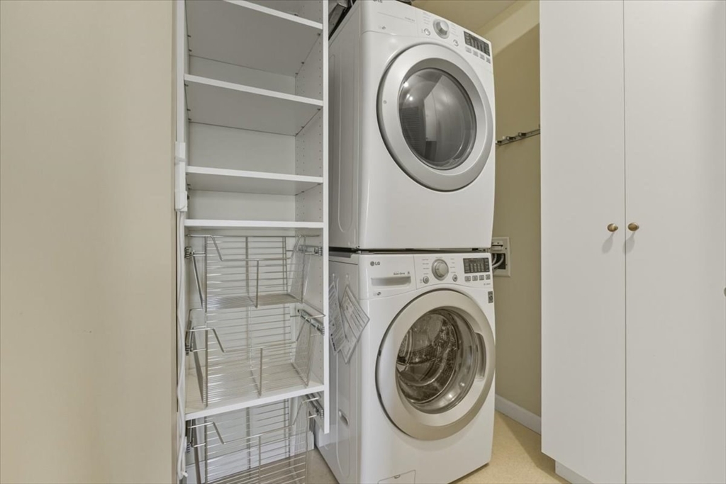 4 Repton Place, Unit 4410 Watertown, MA 02472 - Photo 27 of 41 a utility room with dryer and washer