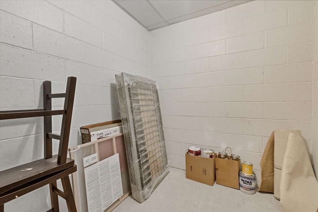 4 Repton Place, Unit 4410 Watertown, MA 02472 - Photo 30 of 41 a view of an empty room with wooden floor and a window