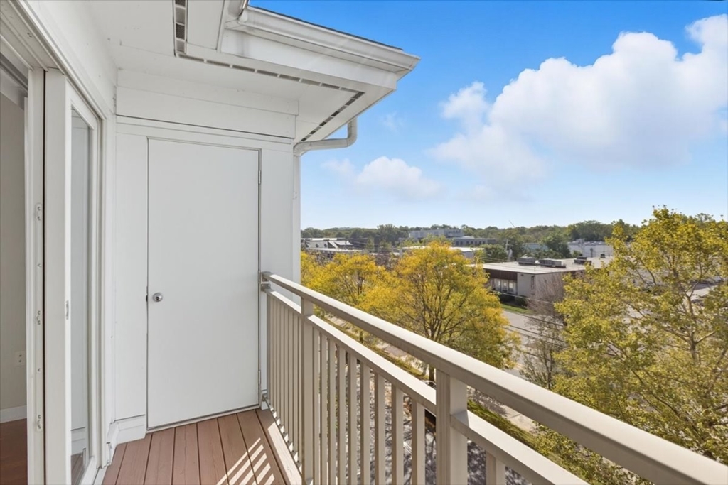4 Repton Place, Unit 4410 Watertown, MA 02472 - Photo 10 of 41 a view of a balcony next to a lake view