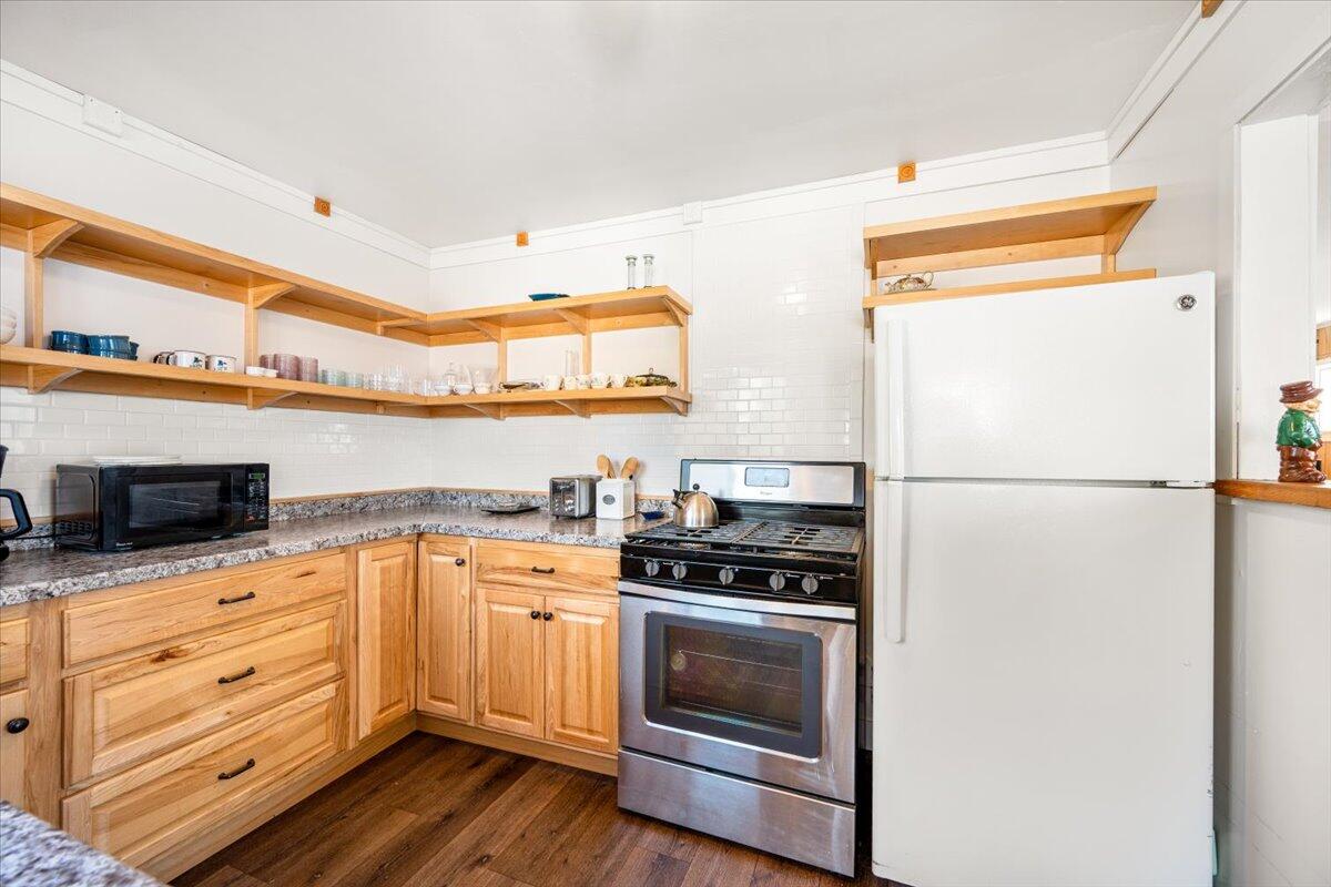 925 Pecho Street Morro Bay, CA 93442 - Photo 15 of 54 a kitchen with stainless steel appliances a stove microwave and a refrigerator