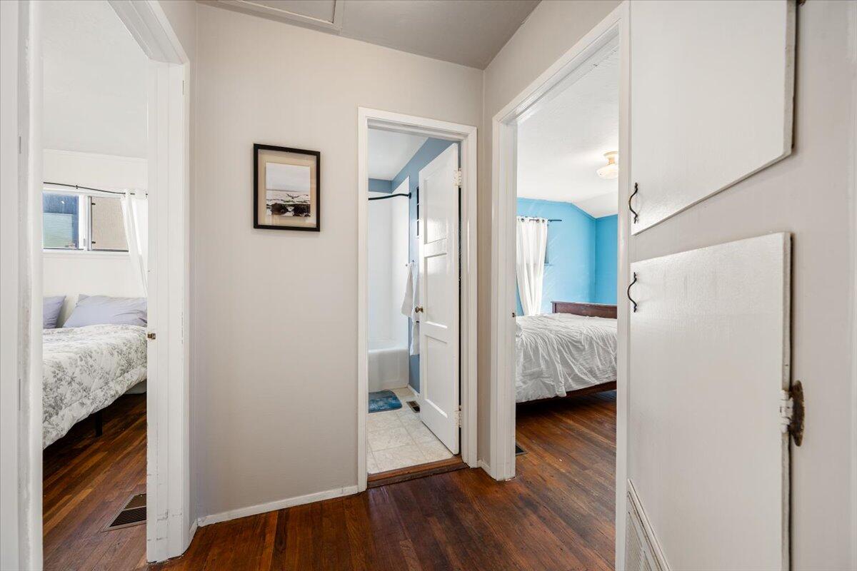 925 Pecho Street Morro Bay, CA 93442 - Photo 16 of 54 a view of bedroom with bathroom and wooden floor