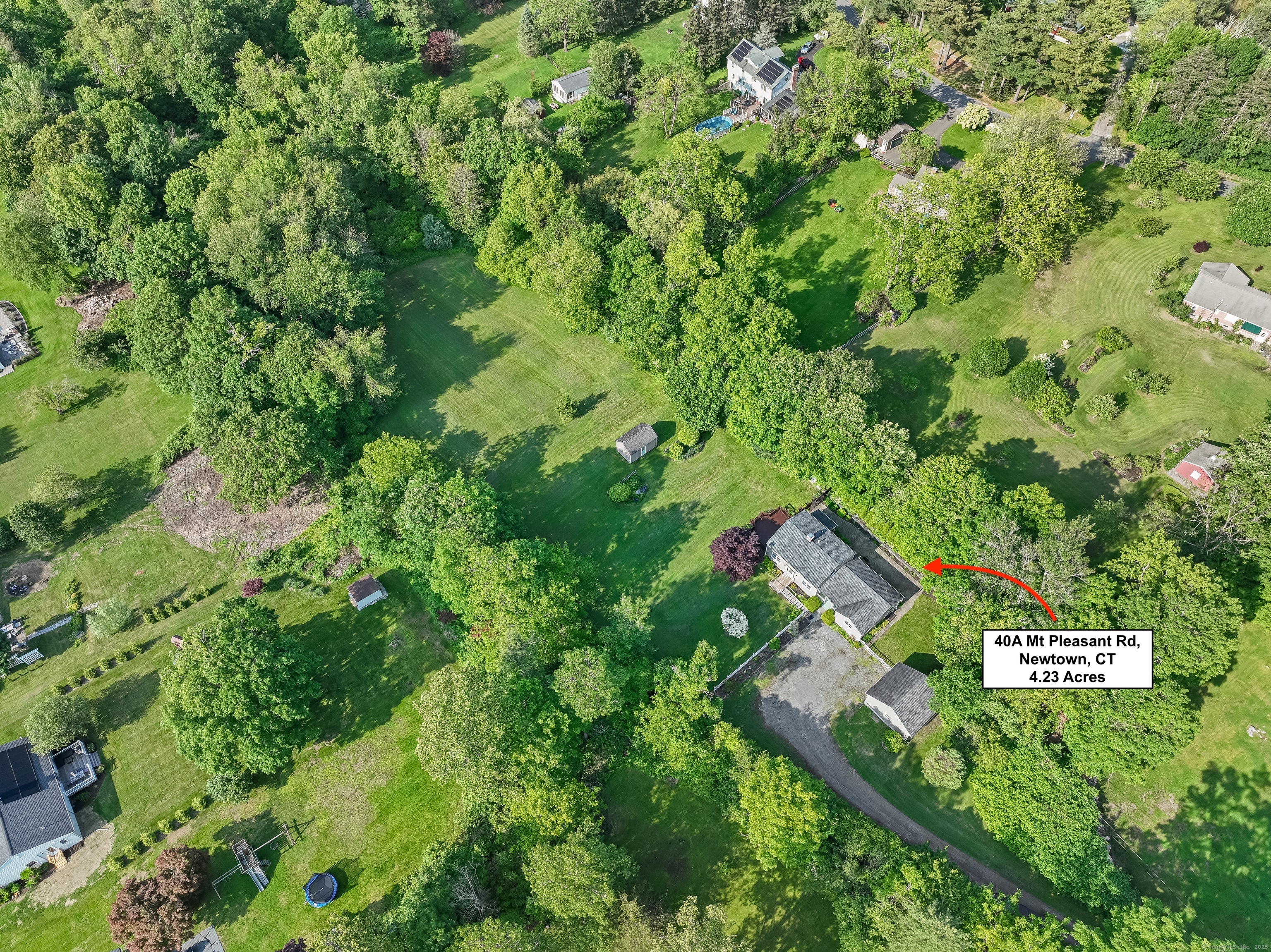 40 A Mt Pleasant Road Newtown, CT 06470 - Photo 1 of 1 an aerial view of residential house with outdoor space and trees all around