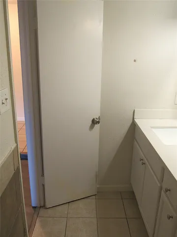 a bathroom with a sink and shower