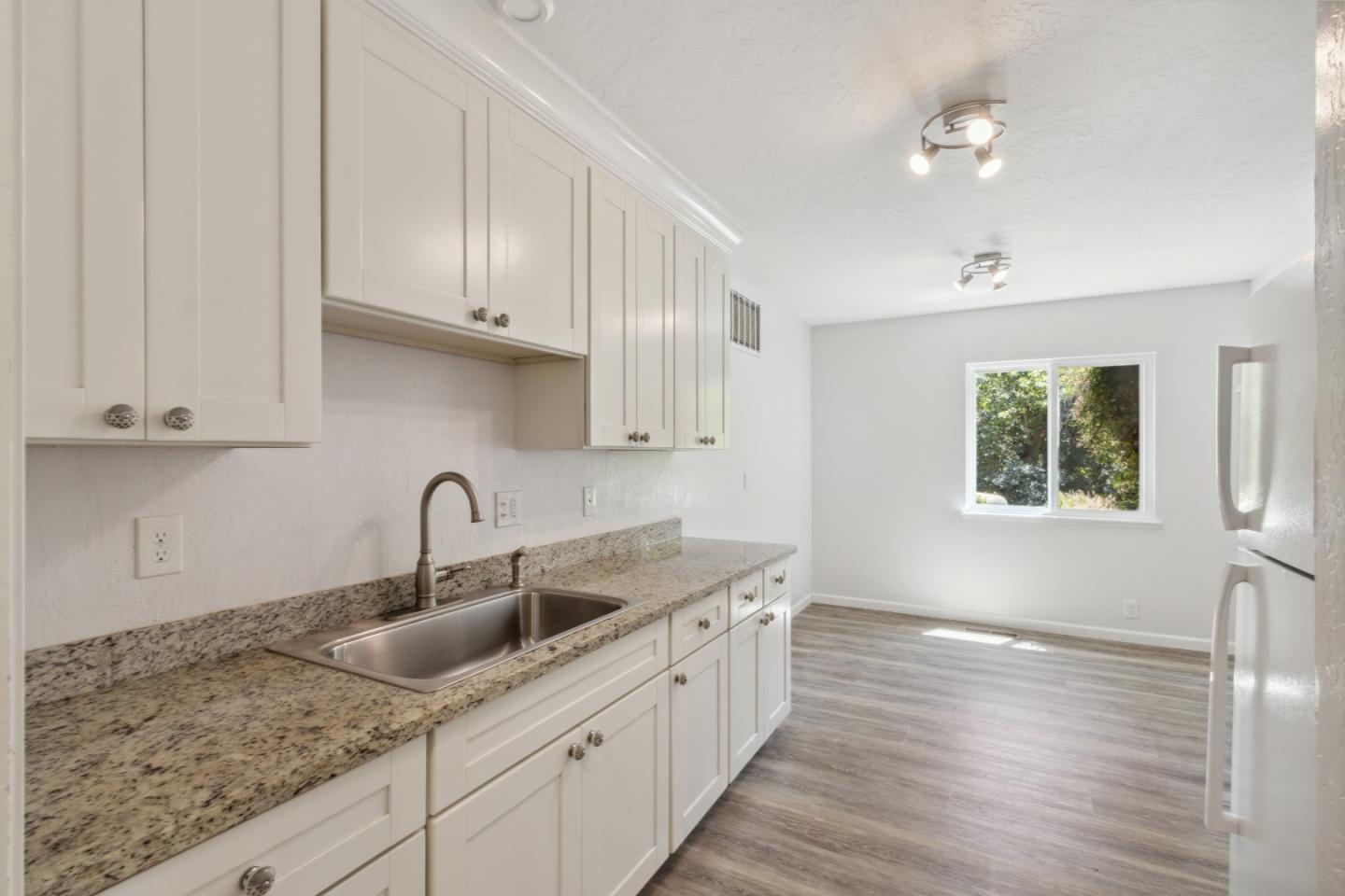 24895 Skyland Road Los Gatos, CA 95033 - Photo 28 of 113 a kitchen with sink cabinets and wooden floor