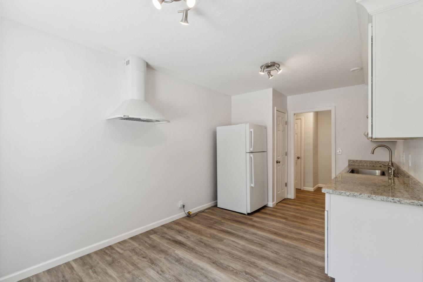 24895 Skyland Road Los Gatos, CA 95033 - Photo 31 of 113 a view of a kitchen with a sink and a refrigerator