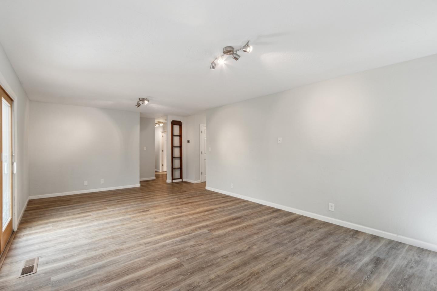 24895 Skyland Road Los Gatos, CA 95033 - Photo 34 of 113 a view of an empty room with wooden floor