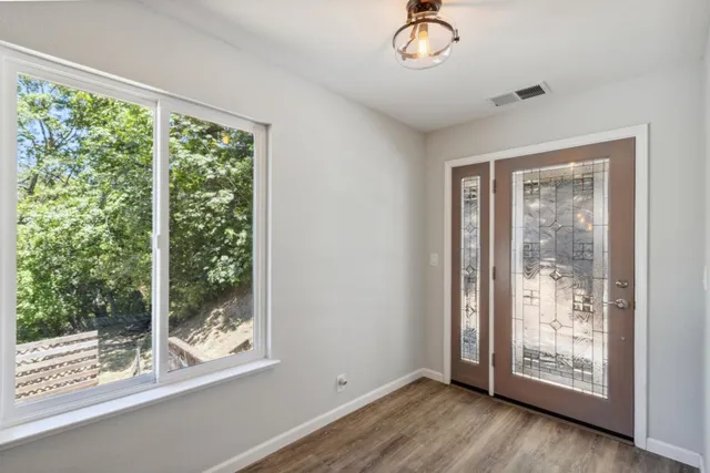 a view of an empty room with a window