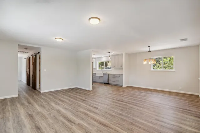 a kitchen with cabinets stainless steel appliances and a counter space