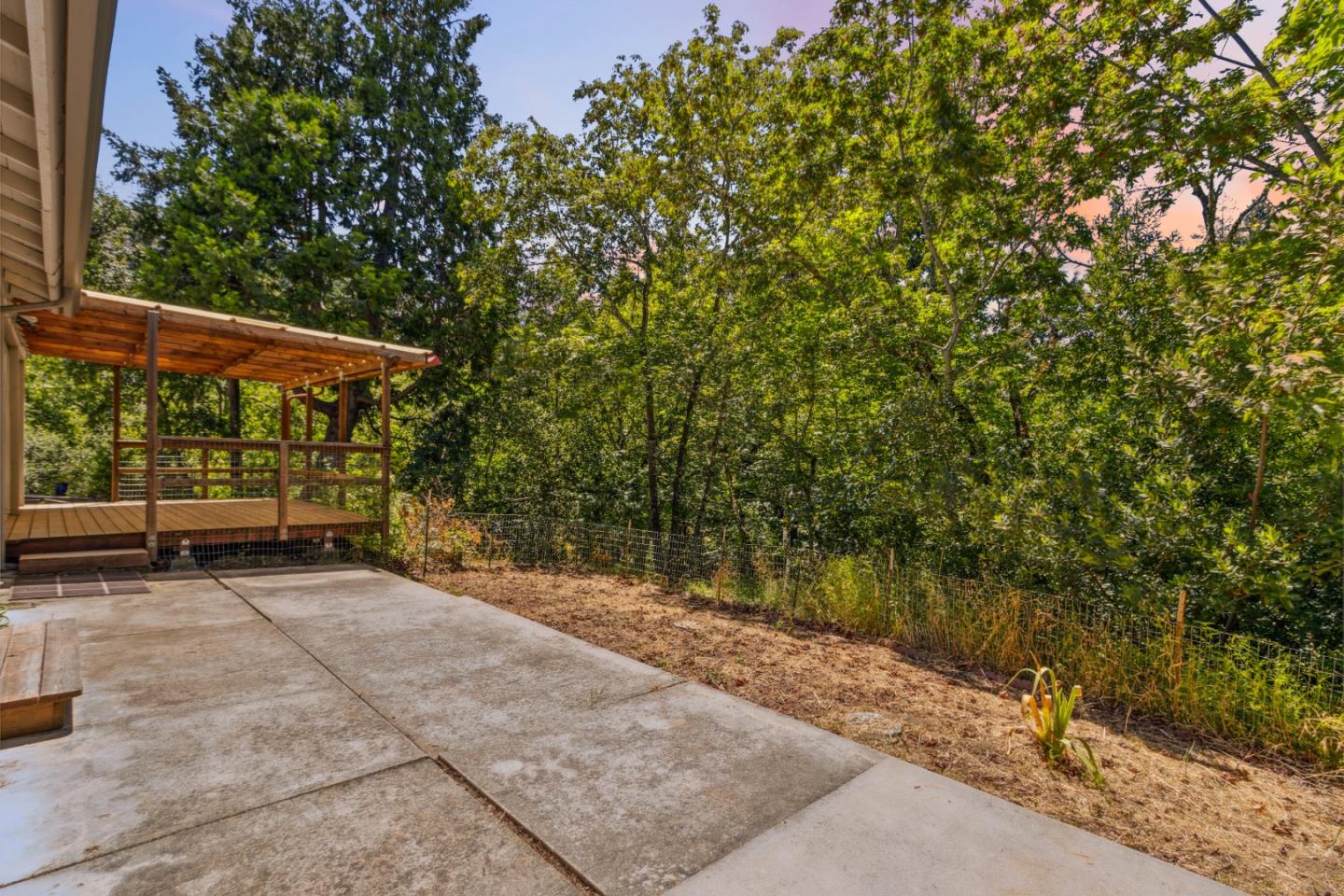 24895 Skyland Road Los Gatos, CA 95033 - Photo 94 of 113 a view of a patio with table and chairs under an umbrella
