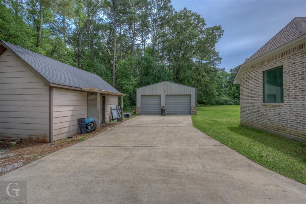 7453 Shirley Francis Road Shreveport, LA 71129 - Photo 3 of 29 a front view of a house with garden