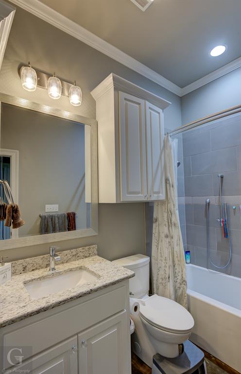 7453 Shirley Francis Road Shreveport, LA 71129 - Photo 7 of 29 a bathroom with a granite countertop sink toilet and shower