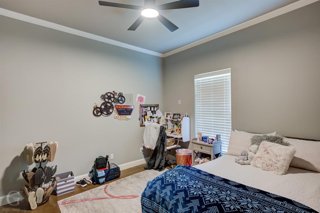 7453 Shirley Francis Road Shreveport, LA 71129 - Photo 8 of 29 a bedroom with furniture and a chandelier