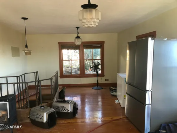 a bedroom with a bed next to a window