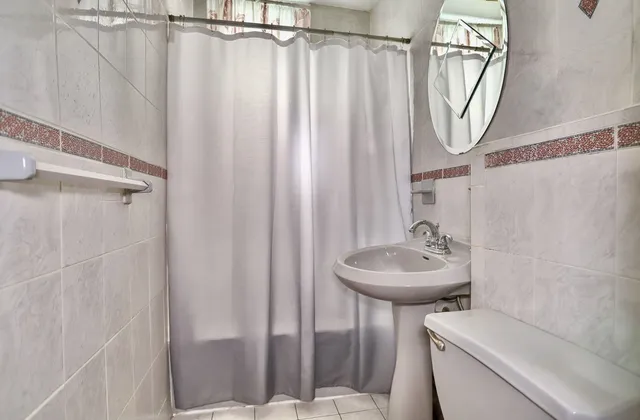 a bathroom with a sink a toilet and tub