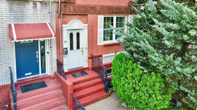 a front view of a house with yard