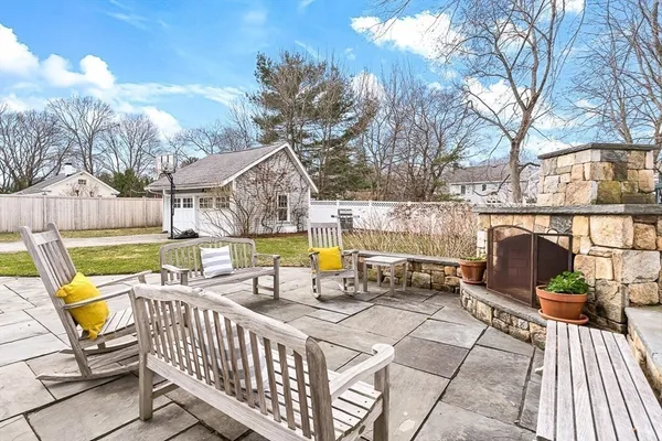 a view of a patio with iron fence