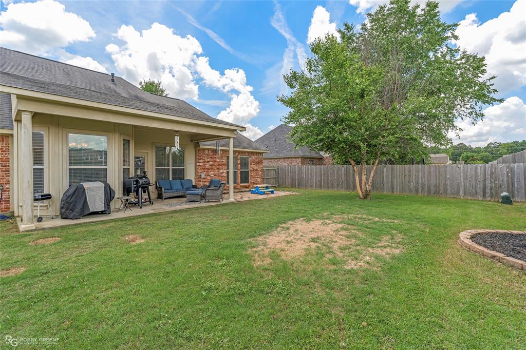 711 Reeds Reef Bossier City, LA 71112 - Photo 32 of 36 a view of a house with a backyard